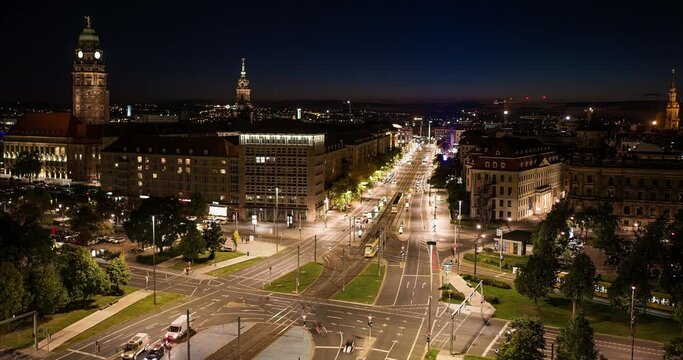 Time lapse video of Dresden Pirnaischer Platz after sunset with city lights and a lot of traffic on the roads. A big junction with many cars and other transportation.