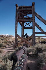Fototapeta na wymiar Old mining machinery at Bodie ghost town, in the Eastern Sierra mountains of California