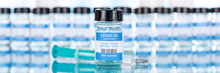 Coronavirus Vaccine bottle Corona Virus syringe COVID-19 Covid vaccines panoramic view copyspace...
