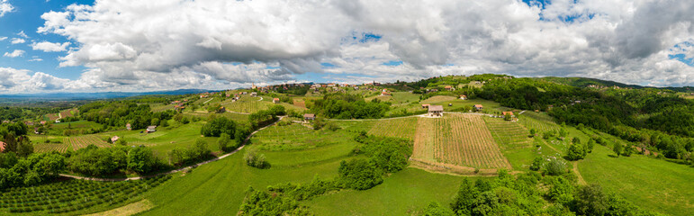 Fototapeta na wymiar Picturesque aerial panorama of spring countryside on a sunny day.