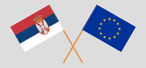 Crossed flags of Serbia and the EU