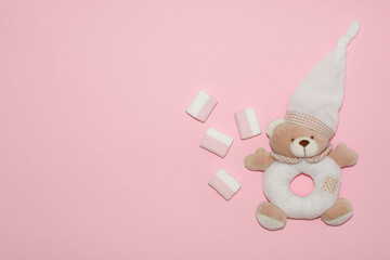 Cute baby girl accessories,teddy bear and marshmallow on pink background.Happy Valentine day concept, copy space