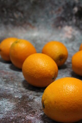 fresh oranges lying on the counter, fresh fruit stacked, orange
