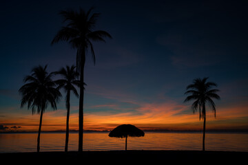 Sunset over the beach and palm trees El Colony (ex Hilton) Isla de Juventud Cuba