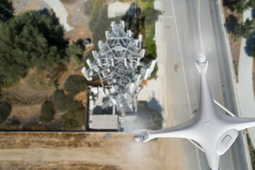 Unmanned Aircraft Drone Flying Near and Inspecting Cell Tower