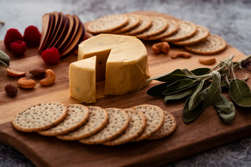 Obraz na płótnie Canvas Vegan cheese tray with crackers and fruit. Vegan charcuterie board.
