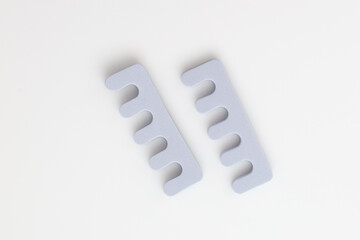 toe separators cosmetic tools for manicure and pedicure on a white background.