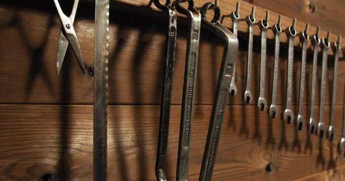 Wrench tool set hanging on wall in vintage garage workshop