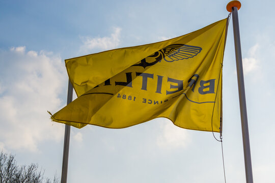 Breitling on a yellow waving flag, popular watch brand and aeronautical sponsor, The Netherlands, march 30, 2019