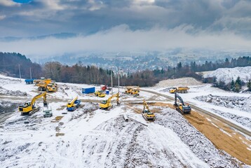 Aerial drone view on winter road construction in Polish Beskidy mountains