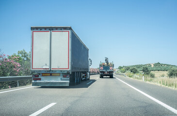 Truck overtaking slowly another truck