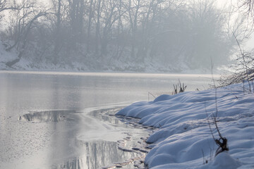 Frozen lake in forest. winter lake under snow
