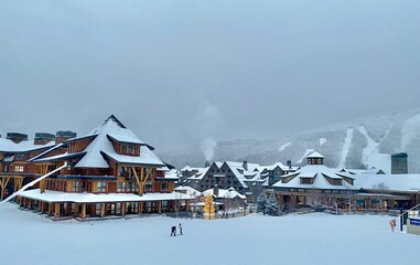 Panoramic view to the Stowe Mountain resort Spruce peak village at evening time early December 2020 Vermont, USA