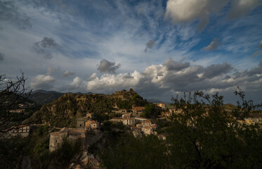 Fototapeta na wymiar Casalvecchio siculo old village on a hill opposite Savoca Sicily Italy