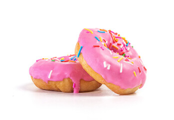 A stack of strawberry flavoured donut with sprinkles on white background. two pink doughnut...