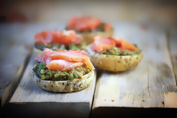 Selective focus. Fish burgers with salmon and avocado. Healthy snack. Healthy fast food.