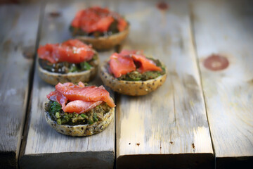 Selective focus. Fish burgers with salmon and avocado. Healthy snack. Healthy fast food.