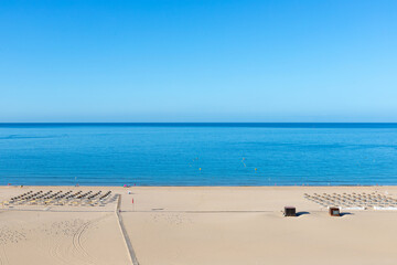 Beach in the morning. View of the Praia da Rocha beach, Portimão, Algarve, Portugal