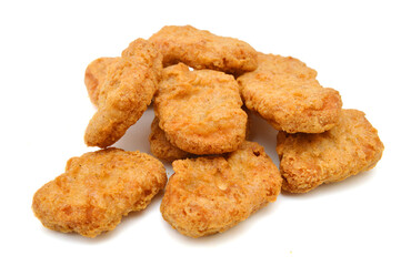 a pile of chicken nuggets on a white background