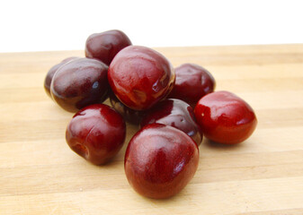 Cherry isolated on wooden board