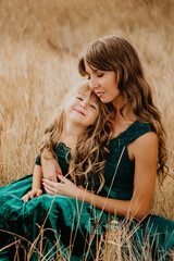 two people relaxing on grass