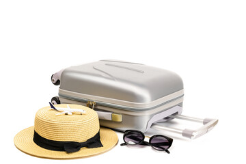 Summer holidays background. Womens accessories traveler: suitcase, straw hat, sunglasses and toy plane isolated on white background with empty space for text. Exotic tropical beach with copy space.