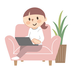 ソファーでパソコン作業をする女