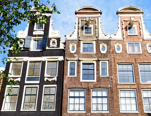 Fototapeta premium Typical Amsterdam houses summer day