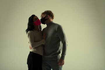 Couple wearing a protective face mask. Love couple. Sensual. 