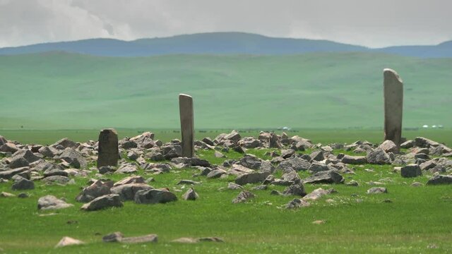 Inscription of obelisk menhir from old ancient times.Deer stone is megalith carved with symbols.Deerstone cemeteries orthostat stele steppe history historical antique petroglyph monuments memorial 4K