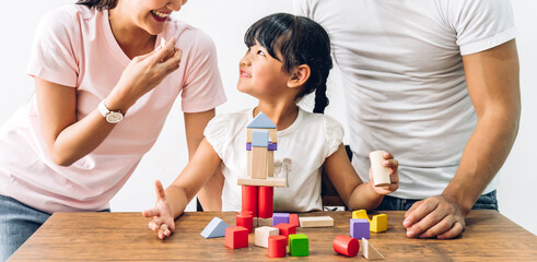 Portrait of enjoy happy love asian family father and mother with little asian girl smiling playing...