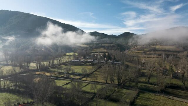 Little village on the mountains  of La Cerdanya covered with fog