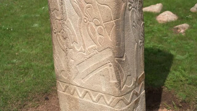 Inscription of obelisk menhir from old ancient times.Deer stone is megalith carved with symbols.Deerstone cemeteries orthostat stele steppe history historical antique petroglyph monuments memorial 4K