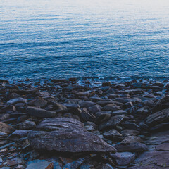 Rocky shore, UK ocean. Cornwall. Sunset. Cool air. Blue. 