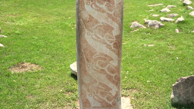 Inscription of obelisk menhir from old ancient times.Deer stone is megalith carved with symbols.Deerstone cemeteries orthostat stele steppe history historical antique petroglyph monuments memorial 4K