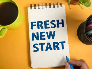 Fresh New Start, text words typography written on book, life and business motivational inspirational concept