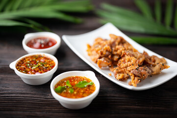 Crispy fried sliced belly pork with spicy sauce