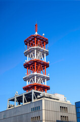 Communications tower with a beautiful blue sky