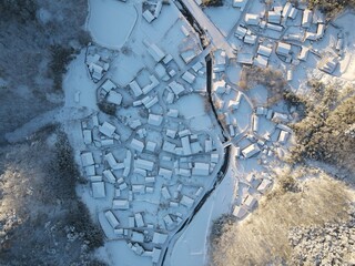 The roofs of rural villages covered with white snow