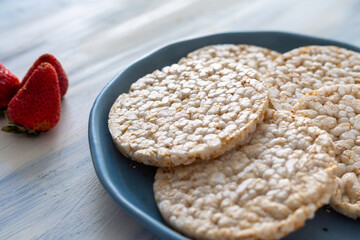 rice crackers, whit fruits on table blue
