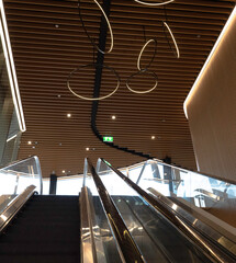 escalator toward way and back way in modern building