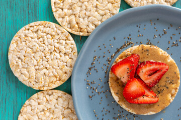 rice crackers, whit fruits on table blue
