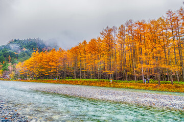Kamikochi National Park in the Northern Japan Alps of Nagano Prefecture, Japan. Beautiful mountain in autumn leaf with river.