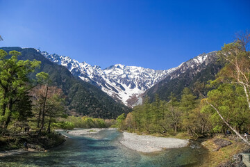 Naklejka na ściany i meble Kamikochi National Park in the Northern Japan Alps of Nagano Prefecture, Japan. Beautiful snow mountain with river. One of the most beautiful place in Japan.