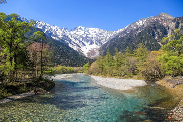 Naklejka na ściany i meble Kamikochi National Park in the Northern Japan Alps of Nagano Prefecture, Japan. Beautiful snow mountain with river. One of the most beautiful place in Japan.