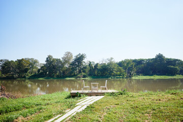 White chairs and table at riverside