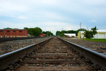 Fototapeta na wymiar Emporia, Kansas 5-16-2015 Examples of railroad track repairs in Emporia, Kansas at the main crossing on Commercial street. Showing where the tracks have been welded and the dates and by whom. 