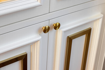 Close-up of white gold cabinets wood in house