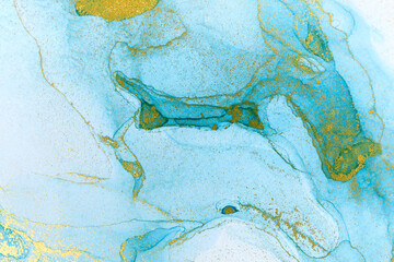 Abstract layers of blue watercolor paint background. Blue and gold wave texture.