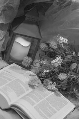 Flowers and a Lantern with an Open Bible
